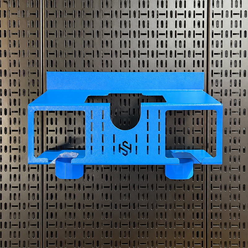 Load image into Gallery viewer, A bright blue 3D-printed wall-mounted shelf with a custom logo, shown against a dark perforated metal pegboard background.
