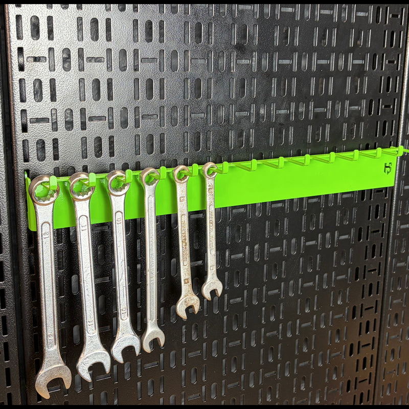 Load image into Gallery viewer, Set of wrenches on a green holder against a black pegboard background

