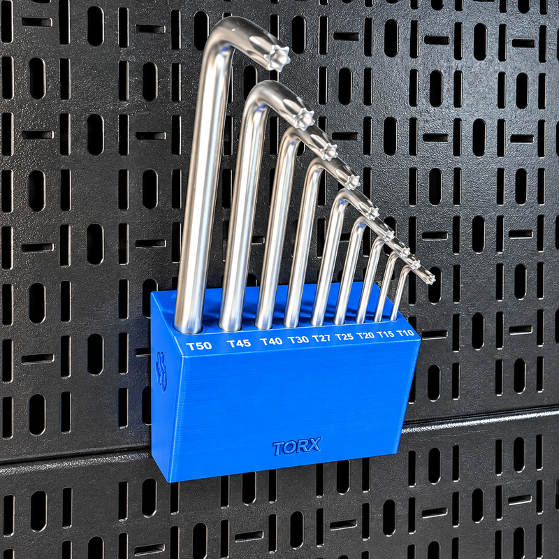 Load image into Gallery viewer, A set of eight silver metal lock picks in graduated sizes, organized in a bright blue plastic holder labeled TORX, mounted on a black metal pegboard.
