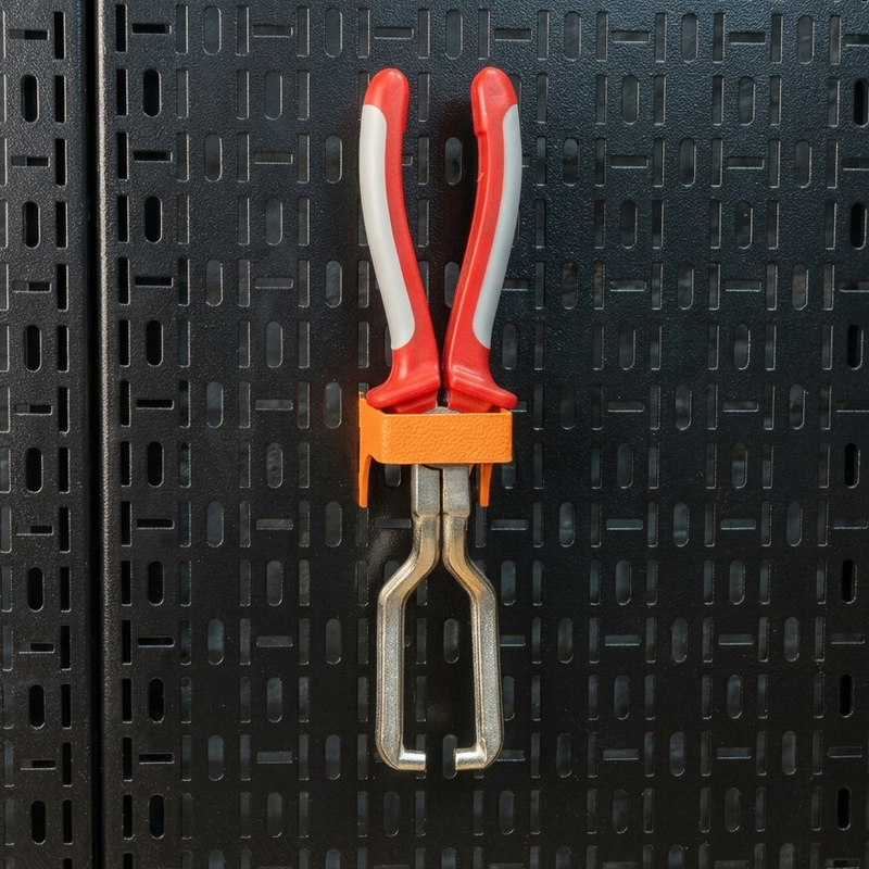 Load image into Gallery viewer, Red and gray pliers with an orange handle on a black textured background
