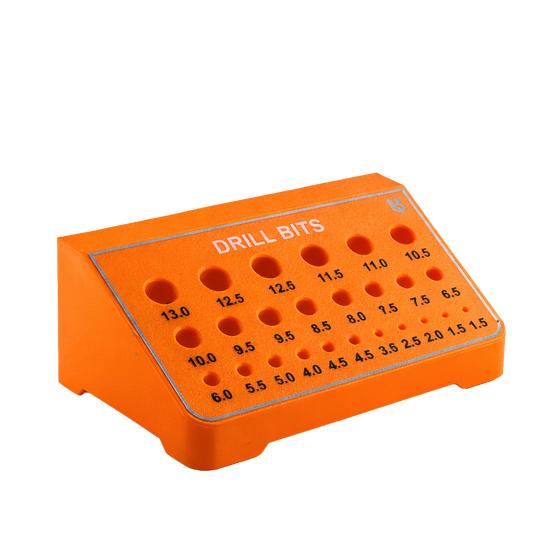 Orange drill bit set organizer with measurement markings on a white background