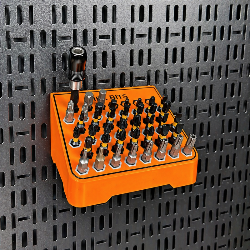 Load image into Gallery viewer, Orange hex bit set on a perforated metal wall
