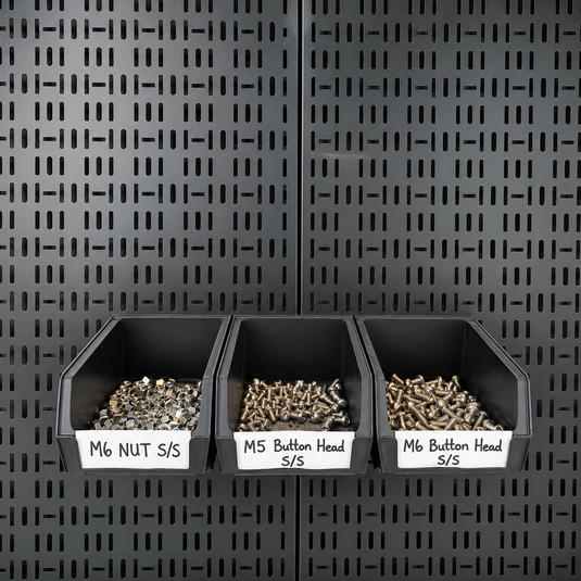 storage bins mounted on a pegboard