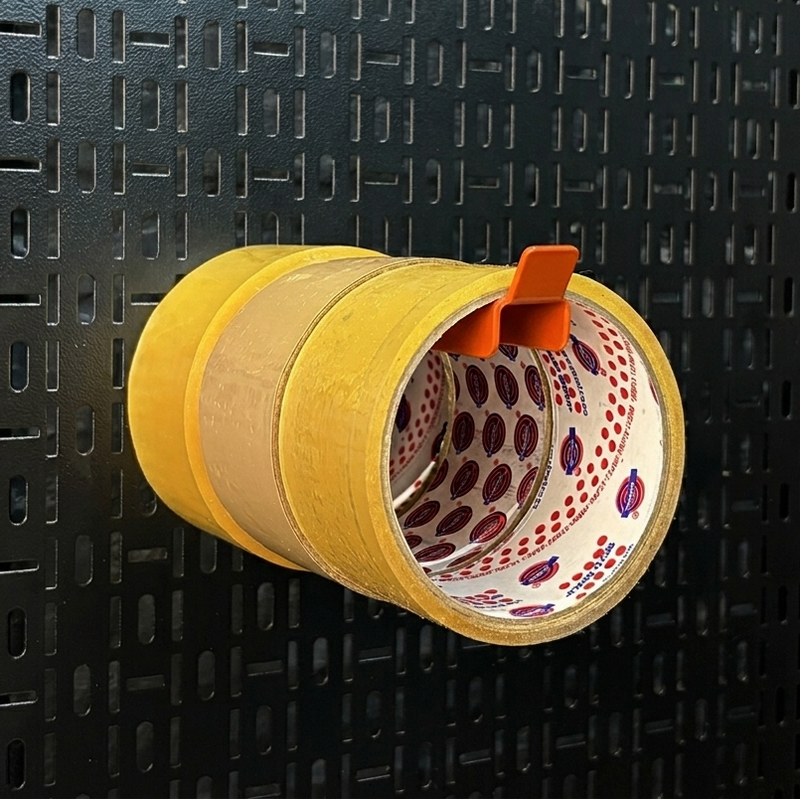 Load image into Gallery viewer, Yellow tape dispenser with patterned tape on a black textured background
