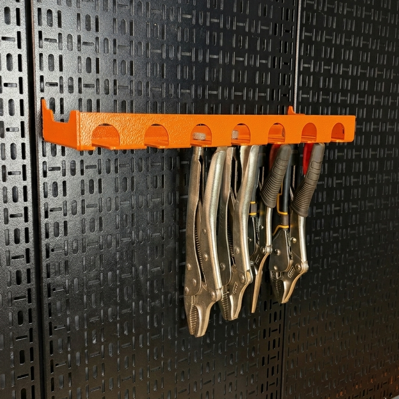 Load image into Gallery viewer, Orange tool holder with vice grips on a black pegboard
